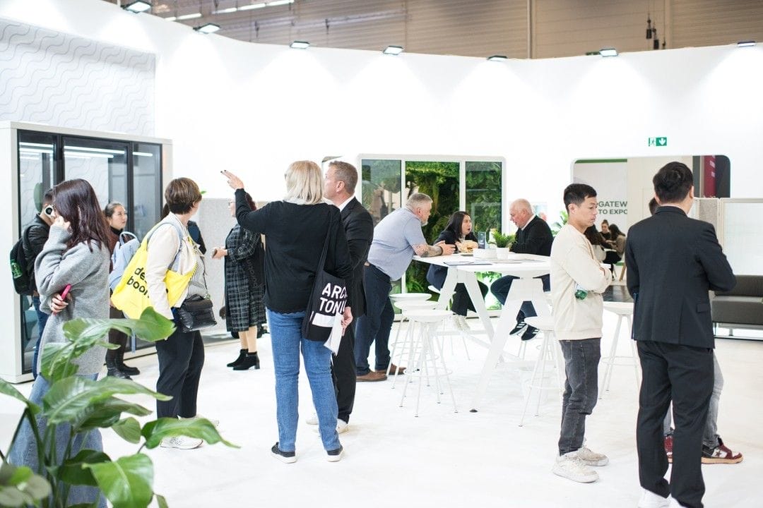 people looking at koplus booths at orgatec 2024