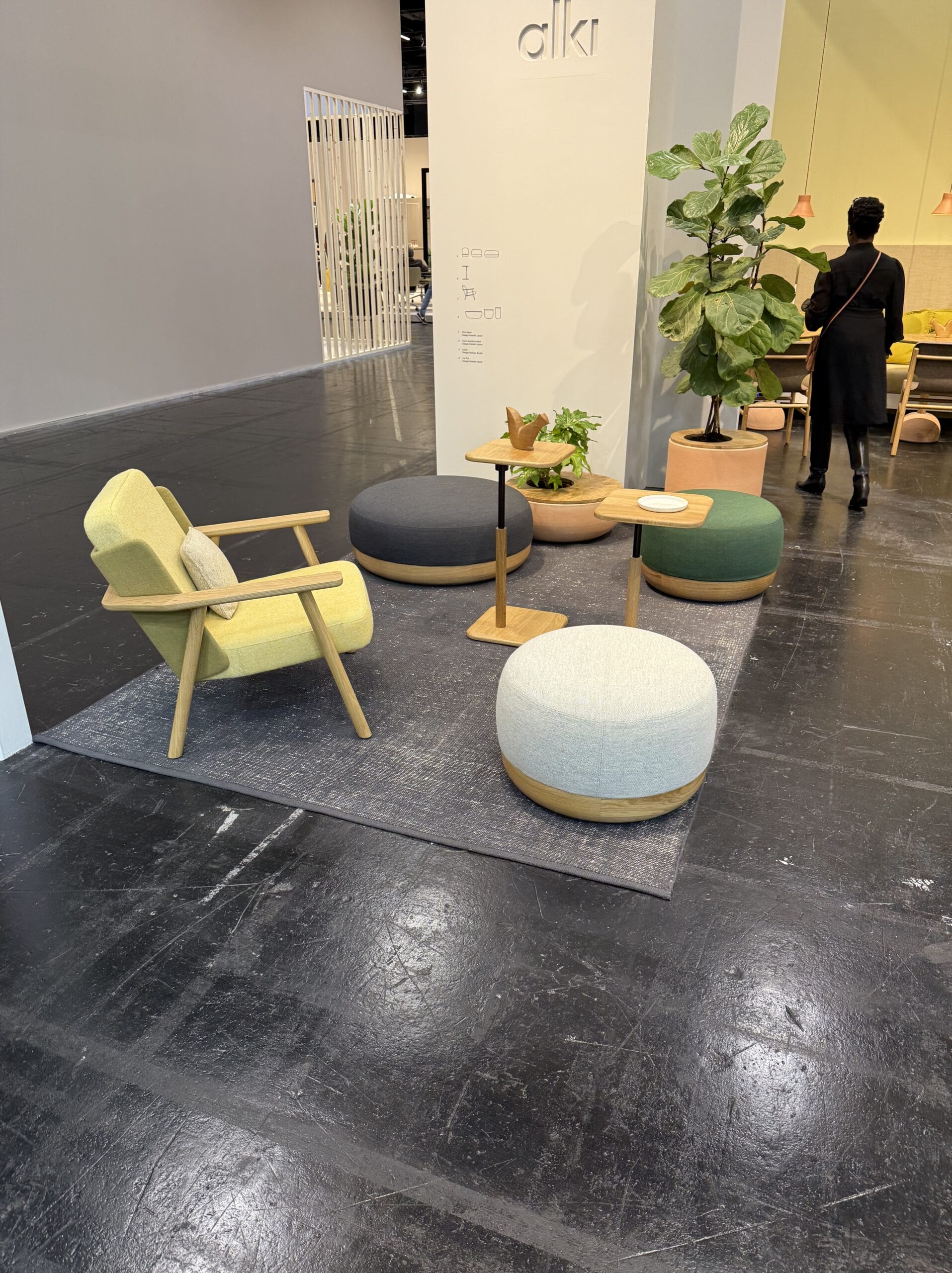 wooden chair and ottomans at orgatec 2024